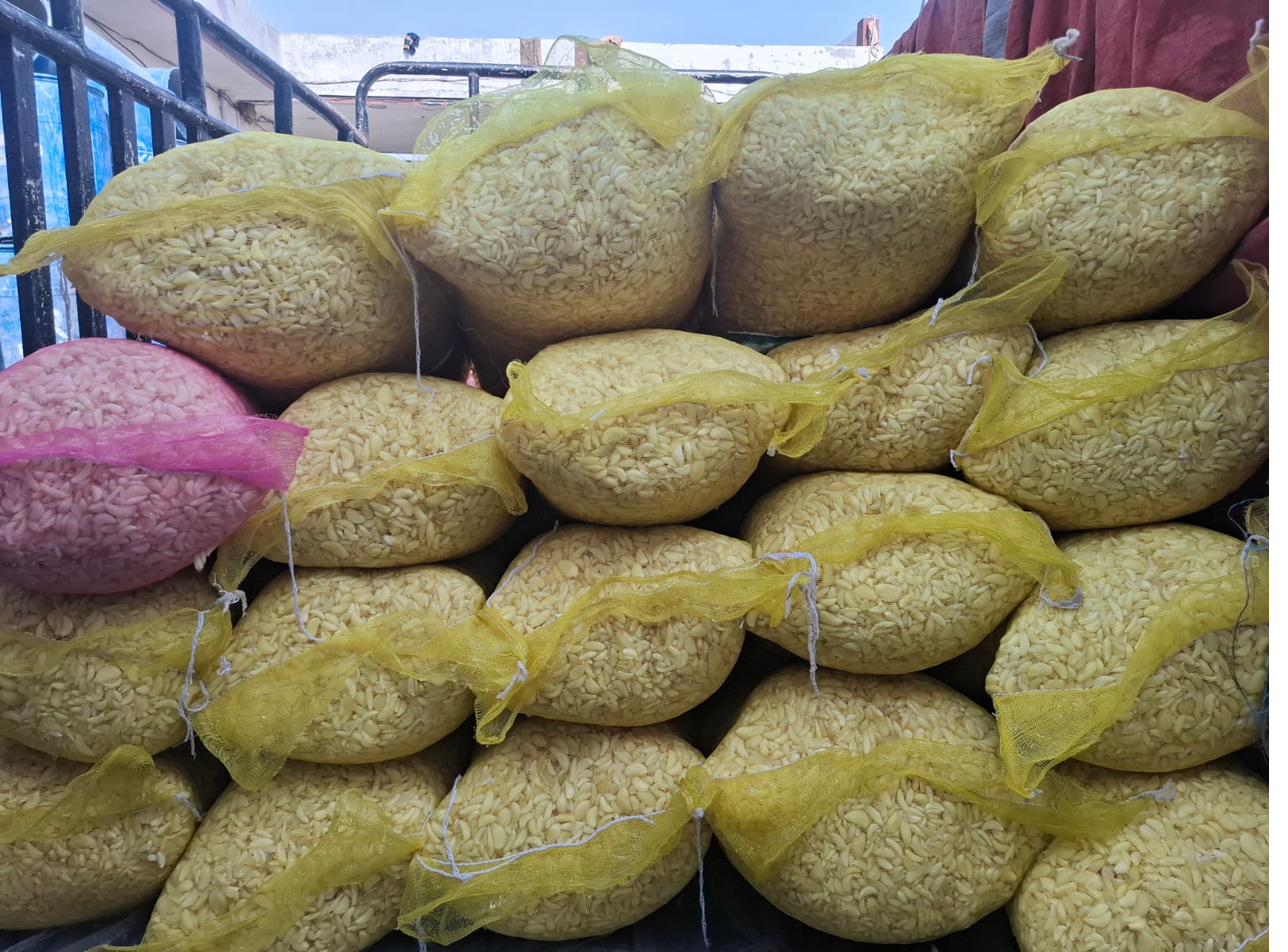 Stacked peeled garlic bags on delivery vehicle